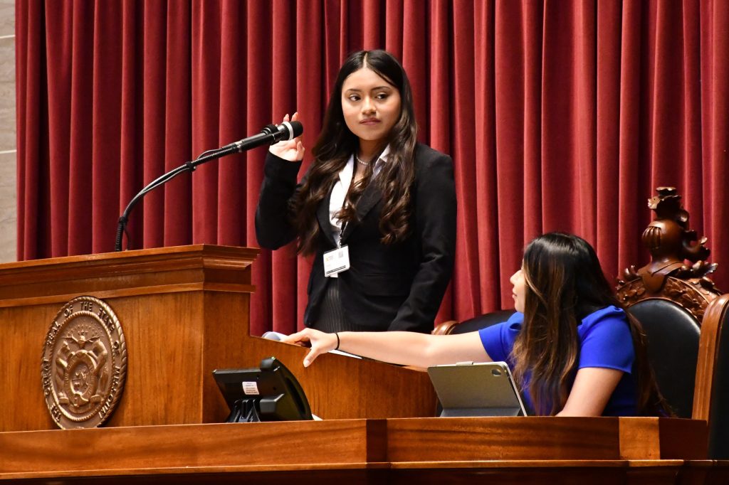 High school women chair a mock legislative session