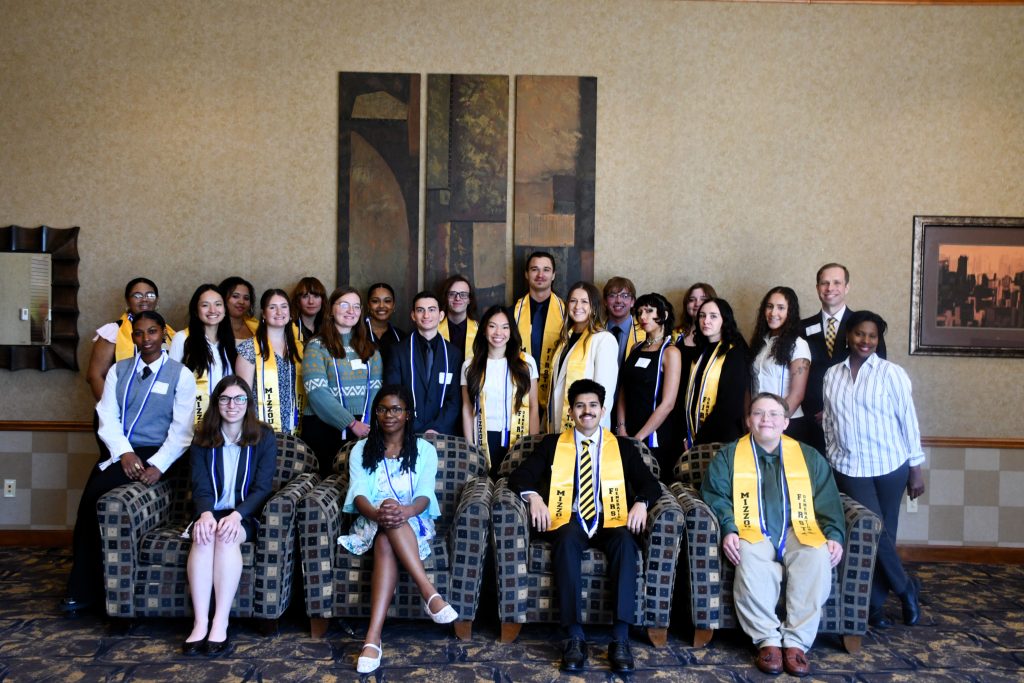 large group photo of McNair Scholars in the conference center lobby